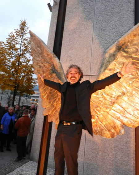 Mexican artist Jorge Marín poses in front of his wings sculpture, Berlin