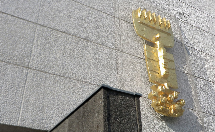 Maria Regina Martyrum, Berlin: a golden sculpture on the marble facade of this modernist memorial church