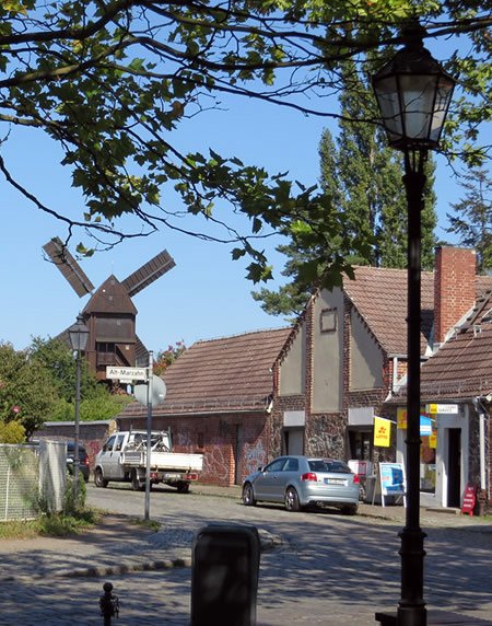 A village complete with farm, church and windmill - but it's surrounded by Marzahn's concrete towers 
