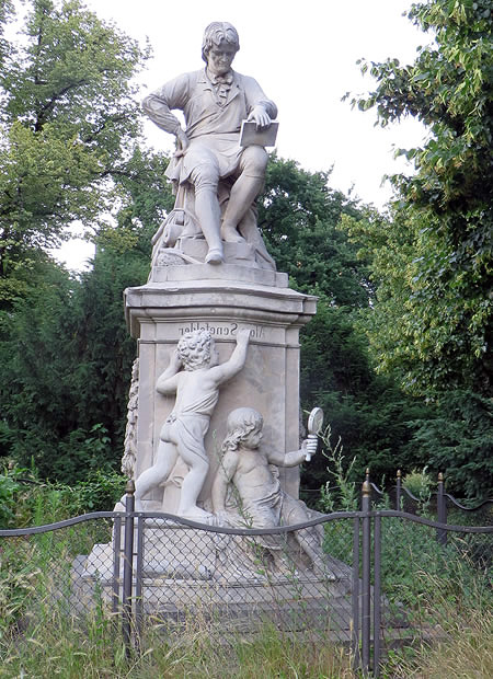 The inscription written backwards: statue of Alois Senefelder, the inventor of lithographic printing, Senefelder Platz, Berlin
