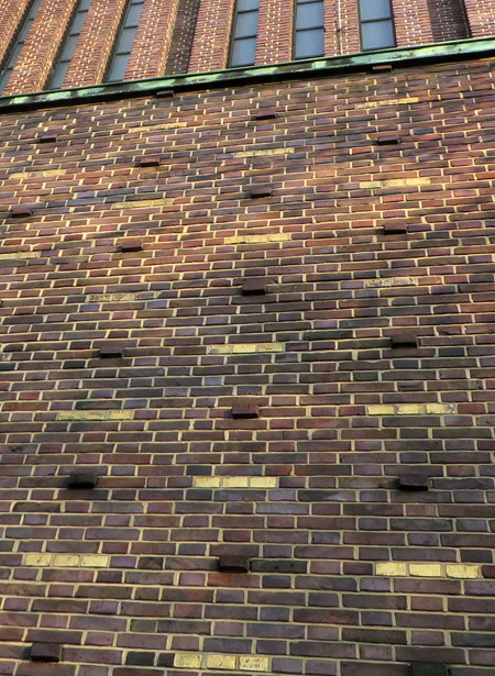 Golden brickwork on the facade of the Church at Hohenzollerndammplatz, Berlin